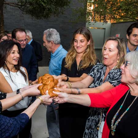 Ladies sharing a loaf of bread