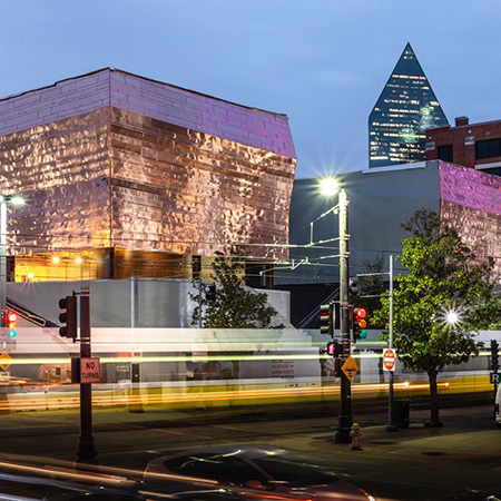 Outside the Dallas Holocaust & Human Rights Museum at night