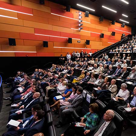 Guests sitting in the Dallas Holocaust & Human Rights Museum’s theater.